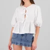 Blusa abullonada con moños lisa