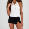 Blusa detalle moño espalada cuello polo