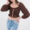 Blusa plisada cintas