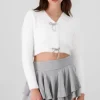 Cardigan botones moños brillos