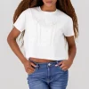 Playera manga corta detalle moños perlas