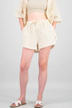 Shorts lisos con mini flores bordadas