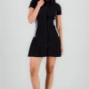 Vestido mini falda tableada cuello polo