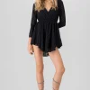 Vestido mini manga larga brillos
