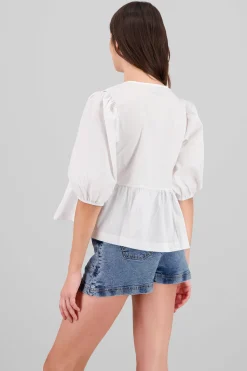 Blusa abullonada con moños lisa