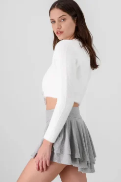 Cardigan botones moños brillos