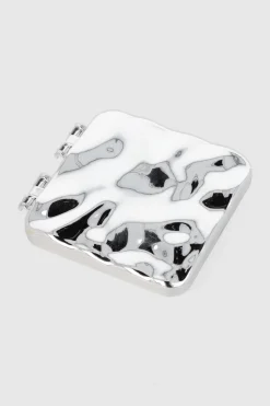 Espejo compacto metal derretido