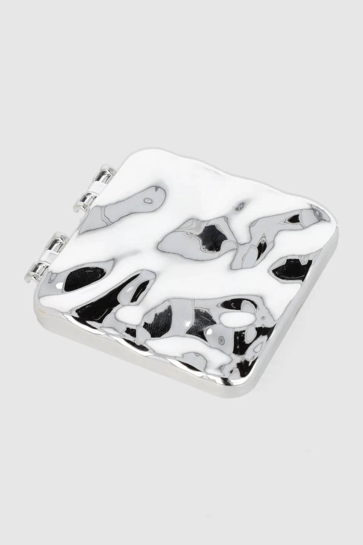 Espejo compacto metal derretido