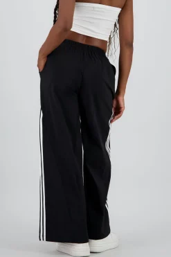 Pantalon amplio detalle franjas contraste