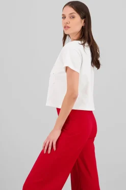 Playera manga corta detalle moños perlas