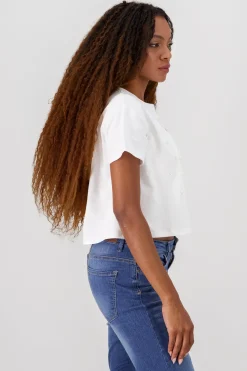 Playera manga corta detalle moños perlas