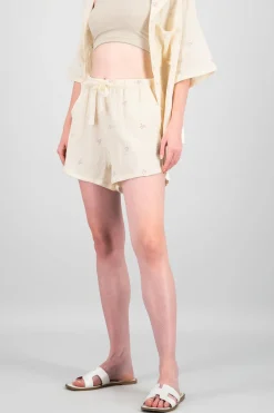 Shorts lisos con mini flores bordadas