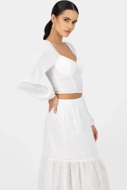 Top de manga larga con copas y detalle de rosa